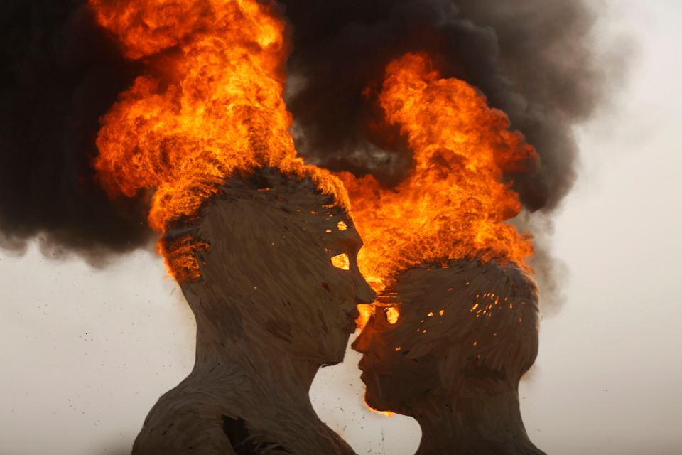 The art installation Embrace burns during the Burning Man 2014 "Caravansary" arts and music festival in the Black Rock Desert of Nevada